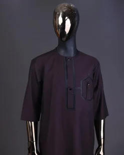 An Umber brown, connected flap and combat pocket with black lines, black Swarovski button detailing kaftan and Sokoto