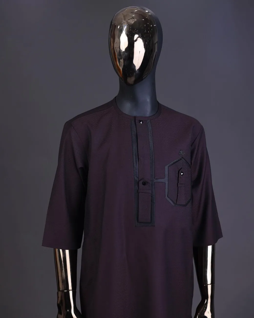 An Umber brown, connected flap and combat pocket with black lines, black Swarovski button detailing kaftan and Sokoto