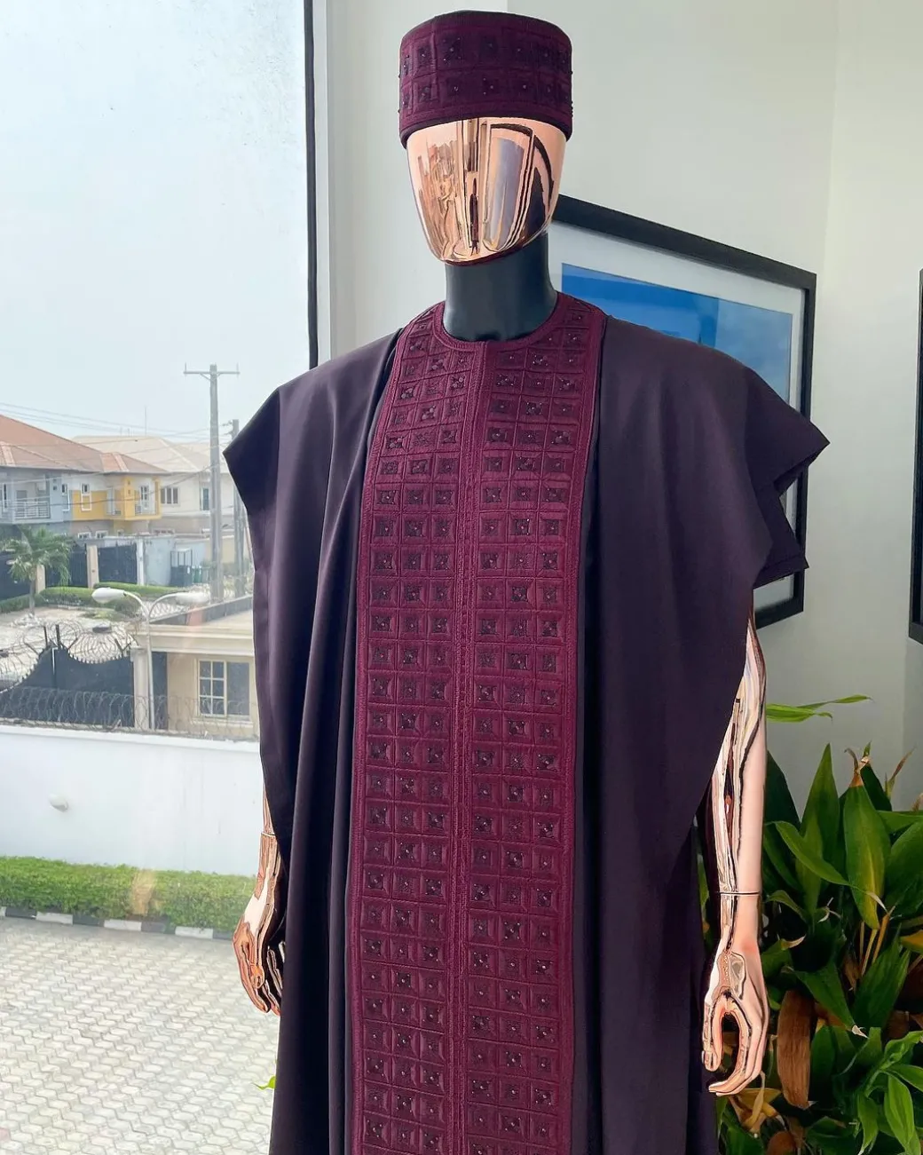 An Umber brown, connected square embroidery design with matching black and brown Swarovski stone details agbada, matching hat, buba & sokoto