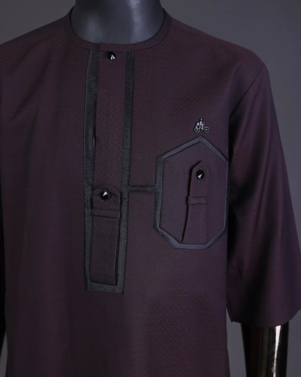 An Umber brown, connected flap and combat pocket with black lines, black Swarovski button detailing kaftan and Sokoto