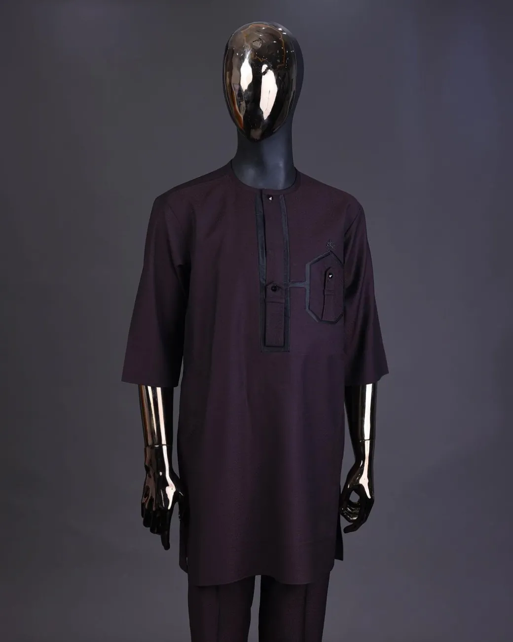An Umber brown, connected flap and combat pocket with black lines, black Swarovski button detailing kaftan and Sokoto