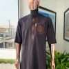 An umber brown, 3D precision anchor embroidery flap and pocket detailing African traditional senator Kaftan native