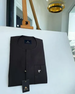 An Umber Brown, Front Flap and Undulating Lift Patch Pocket Detailing Senator Kaftan Native.