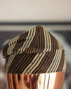 An umber brown Yoruba traditional African hat or fila