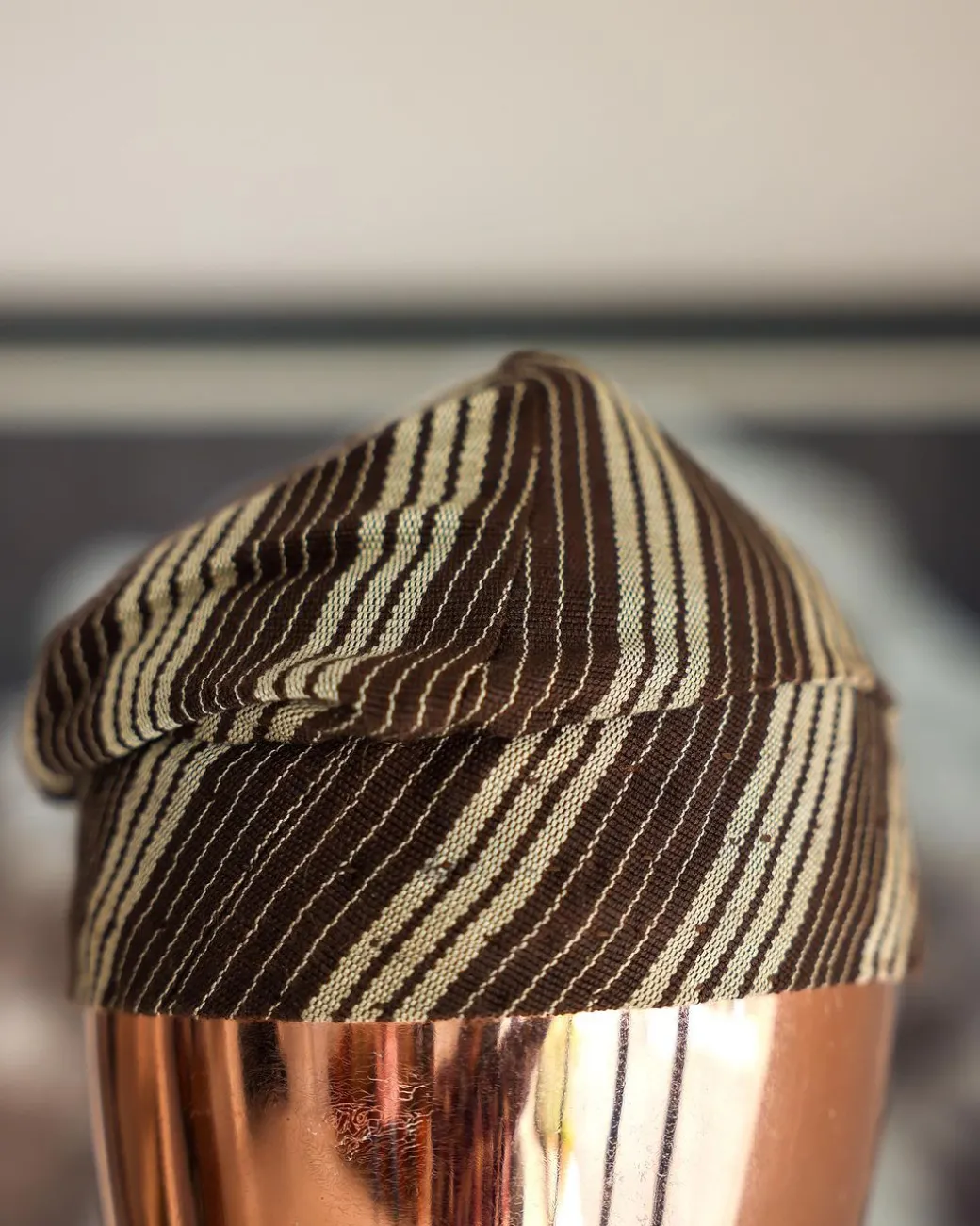 An umber brown Yoruba traditional African hat or fila