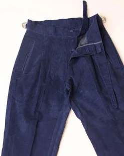 Gurkha trousers with pleats, double side strap buckles, slanted front welt pockets, and a back patch pocket.