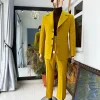 The “ Festac 77” mustard yellow 3 button safari suit