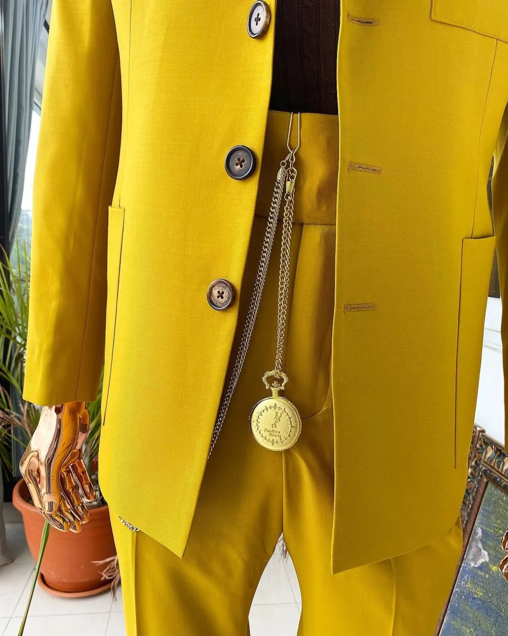 The “ Festac 77” mustard yellow 3 button safari suit