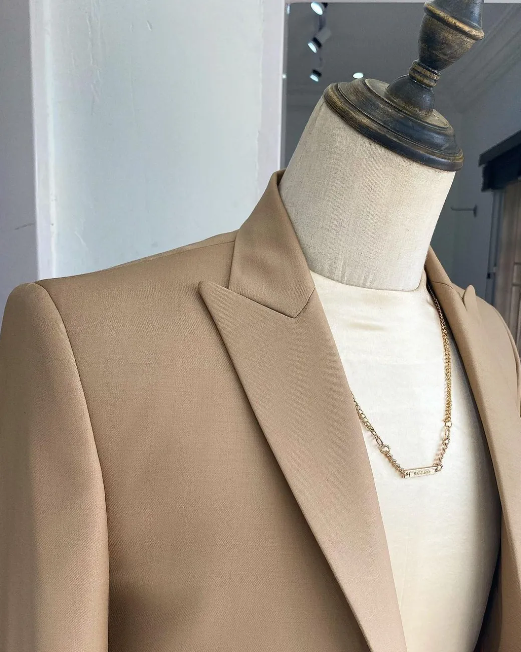 The “Diego Maradona” monochrome Champagne Gold peak lapel business suit