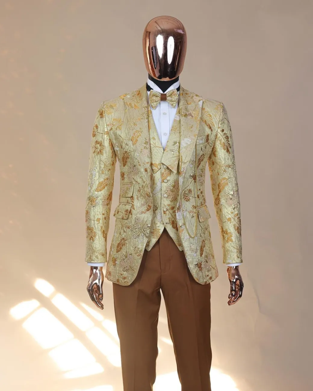 The “Metaphor” gold and splash of caramel brown peak lapel metallic jacquard tuxedo suit