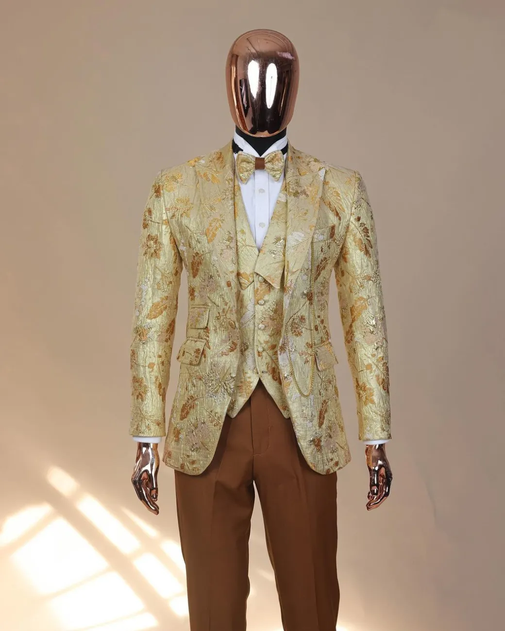 The “Metaphor” gold and splash of caramel brown peak lapel metallic jacquard tuxedo suit