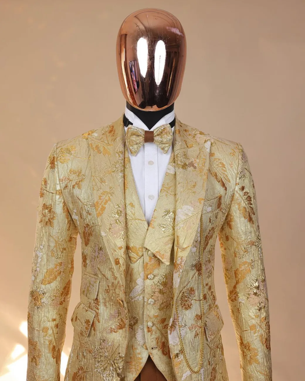 The “Metaphor” gold and splash of caramel brown peak lapel metallic jacquard tuxedo suit