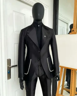 The Monochrome “okorodudu” mikado satin, charcoal black, big-notch lapel suit.