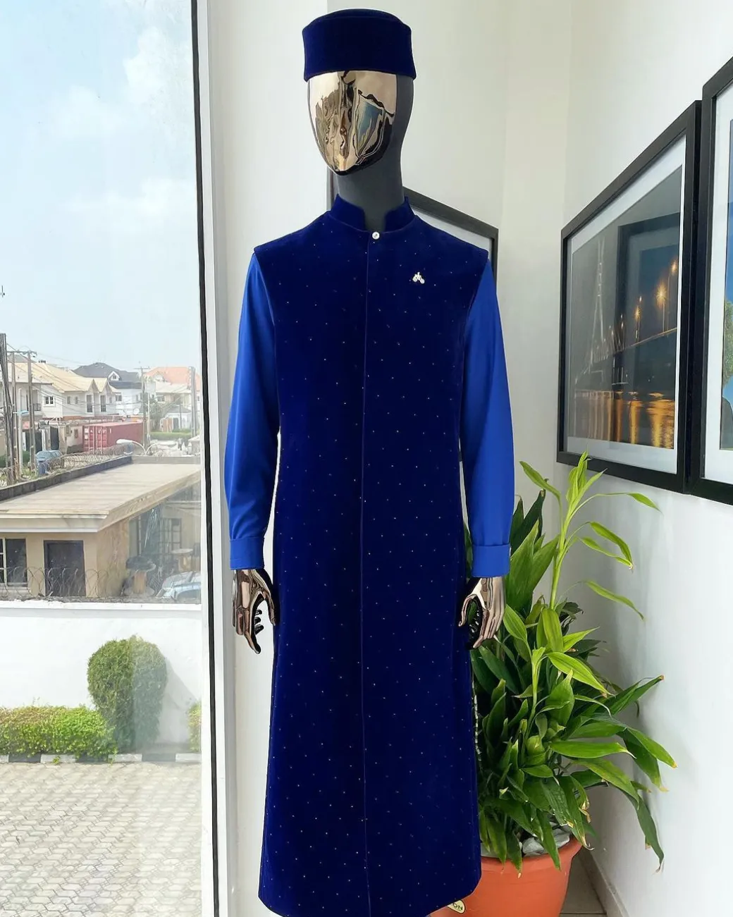 The “orunmila” navy blue Trench soaked Italian velvet traditional jacket with black Swarovski stones detailing, matching hat, cobalt blue Senator kaftan & pant trousers.